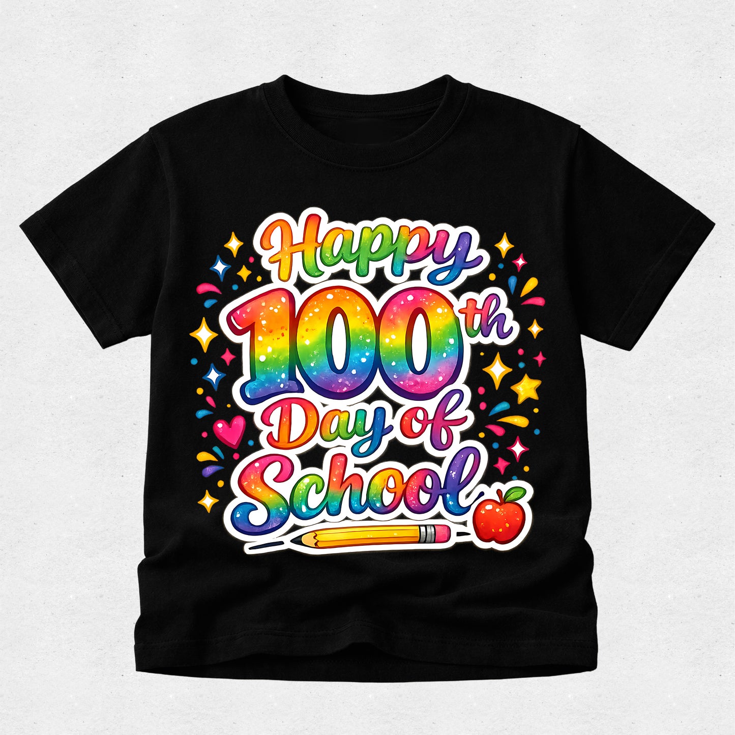 A black short-sleeve t-shirt with a colorful 'Happy 100th Day of School' graphic on the front, featuring a rainbow gradient, stars, hearts, a pencil, and an apple, displayed against a light gray background.