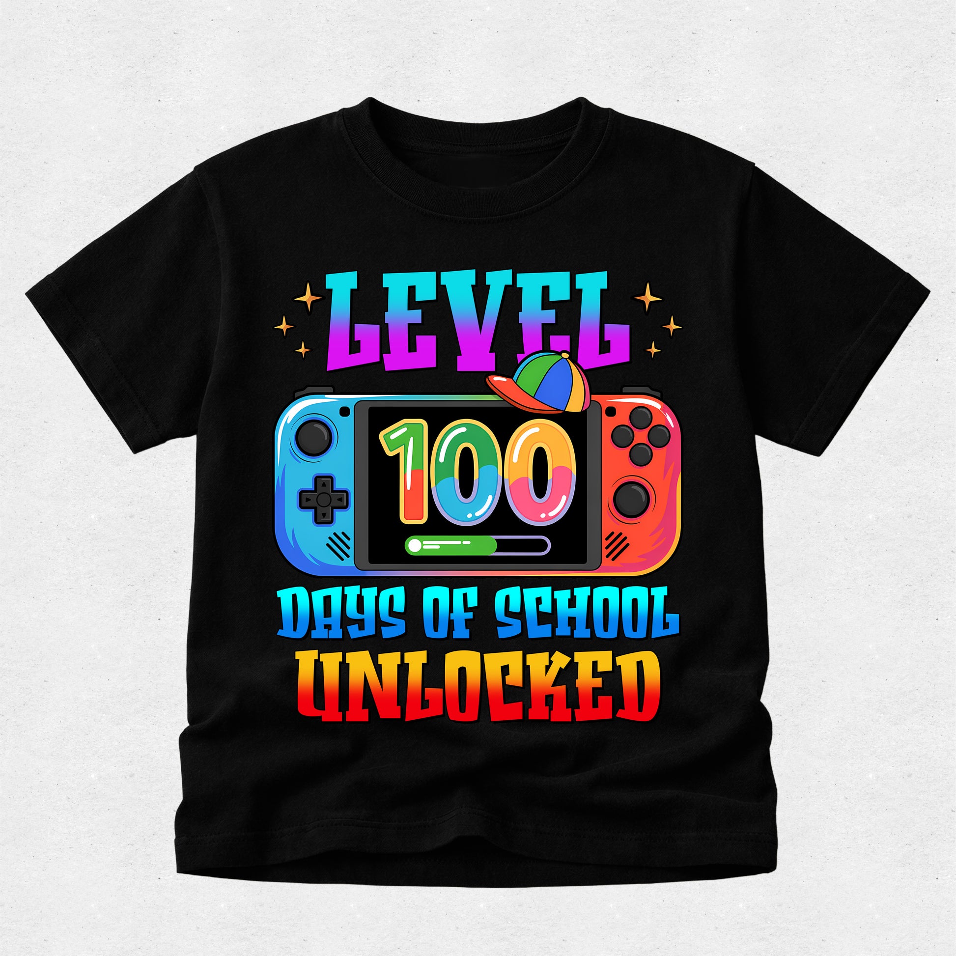 A black short-sleeve t-shirt with a colorful graphic on the front. The graphic features the text 'LEVEL 100 DAYS OF SCHOOL UNLOCKED' in a rainbow gradient font, with a Nintendo Switch console illustration in the center.