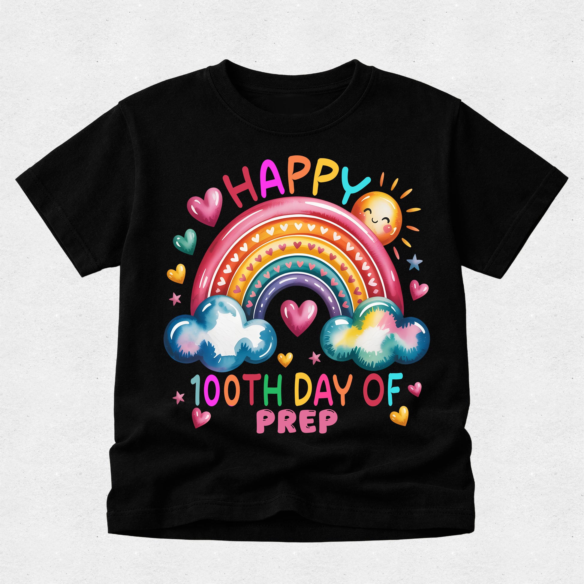 A black short-sleeve t-shirt with a colorful graphic on the front featuring a rainbow, clouds, hearts, a smiling sun, and the text 'HAPPY 100TH DAY OF PREP'.