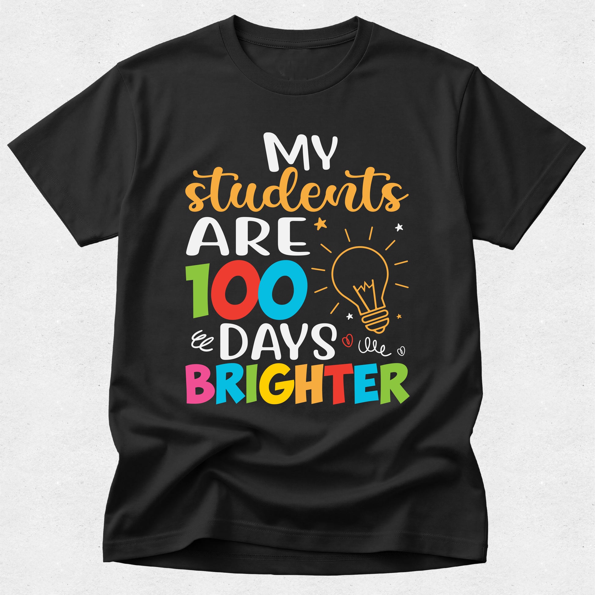 Black t-shirt with colorful text and light bulb graphic on a white background