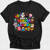 A black short-sleeve crewneck t-shirt featuring a colorful graphic print on the front. The graphic displays the text 'TODAY A READER TOMORROW A LEADER' in multicolored letters, surrounded by cartoon animals including a penguin, elephant, monkey, bear, and duck, along with colorful books, stars, and hearts, all set against a light gray background.