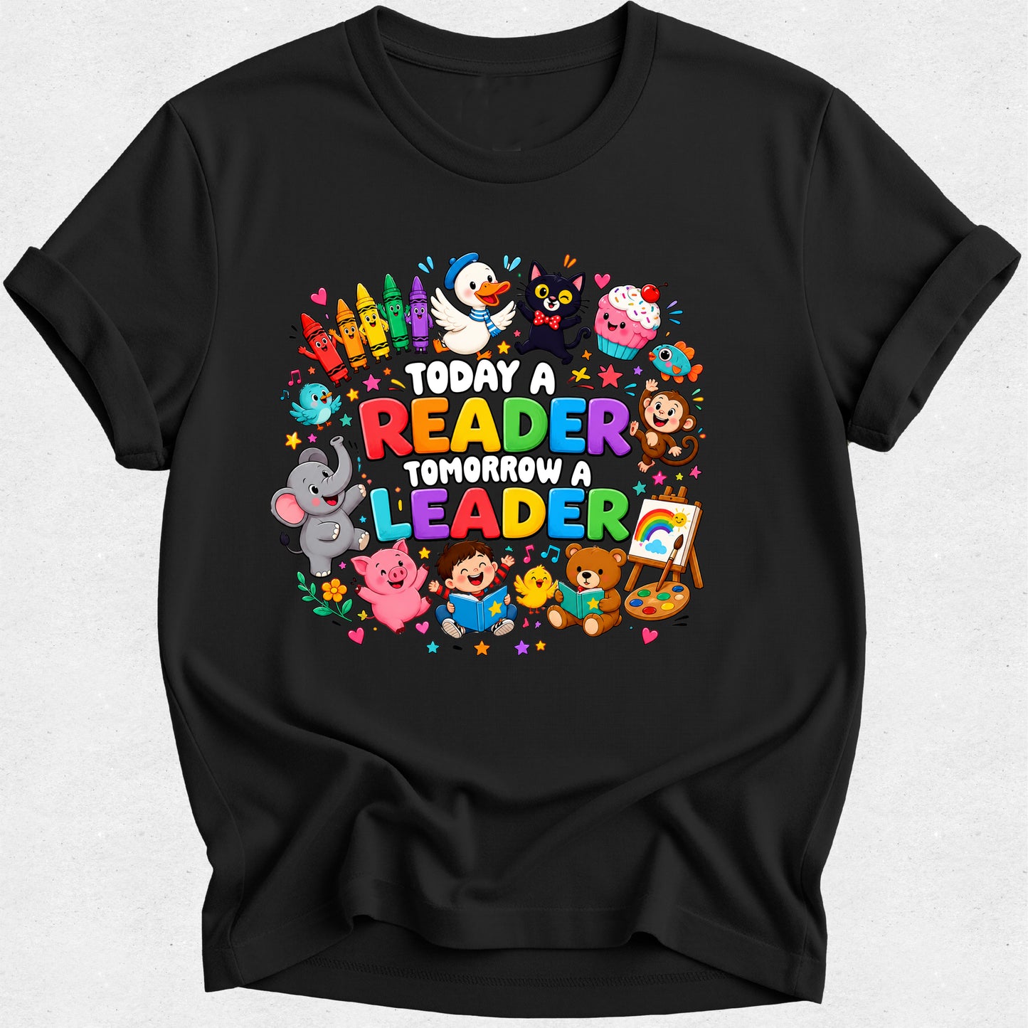 A black short-sleeve crewneck t-shirt featuring a colorful graphic print on the front. The graphic displays the text 'TODAY A READER TOMORROW A LEADER' in multicolored letters, surrounded by cartoon animals including a penguin, elephant, monkey, bear, and duck, along with colorful books, stars, and hearts, all set against a light gray background.