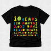 A black short-sleeve t-shirt with a colorful graphic text print celebrating 10 years, showing conversions from years to seconds in a vibrant multicolor font.