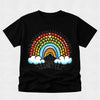 A black short-sleeve crewneck t-shirt featuring a colorful retro rainbow graphic on the front. The graphic includes a rainbow arch made of small hearts, a yellow sun, two white clouds, and the text '100 DAYS BRIGHTER' in a stylized font.