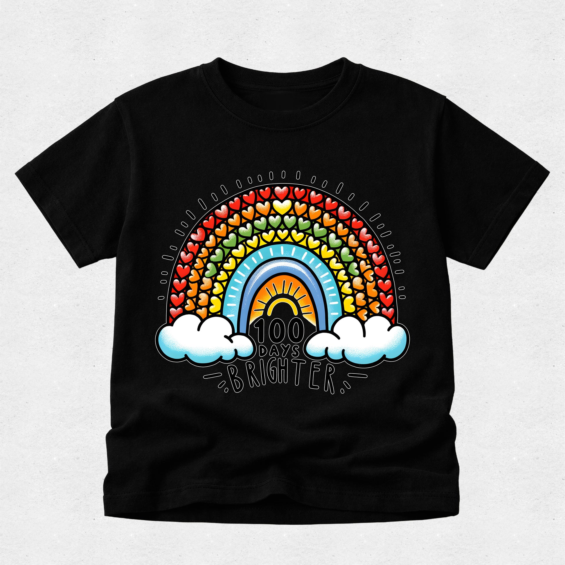 A black short-sleeve crewneck t-shirt featuring a colorful retro rainbow graphic on the front. The graphic includes a rainbow arch made of small hearts, a yellow sun, two white clouds, and the text '100 DAYS BRIGHTER' in a stylized font.