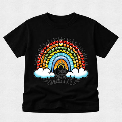 A black short-sleeve crewneck t-shirt featuring a colorful retro rainbow graphic on the front. The graphic includes a rainbow arch made of small hearts, a yellow sun, two white clouds, and the text '100 DAYS BRIGHTER' in a stylized font.