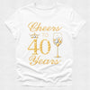 White t-shirt with gold 'Cheers to 40 Years' text and champagne glass design on a white background
