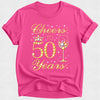 Pink t-shirt with 'Cheers to 50 Years' text and wine glass design on a white background