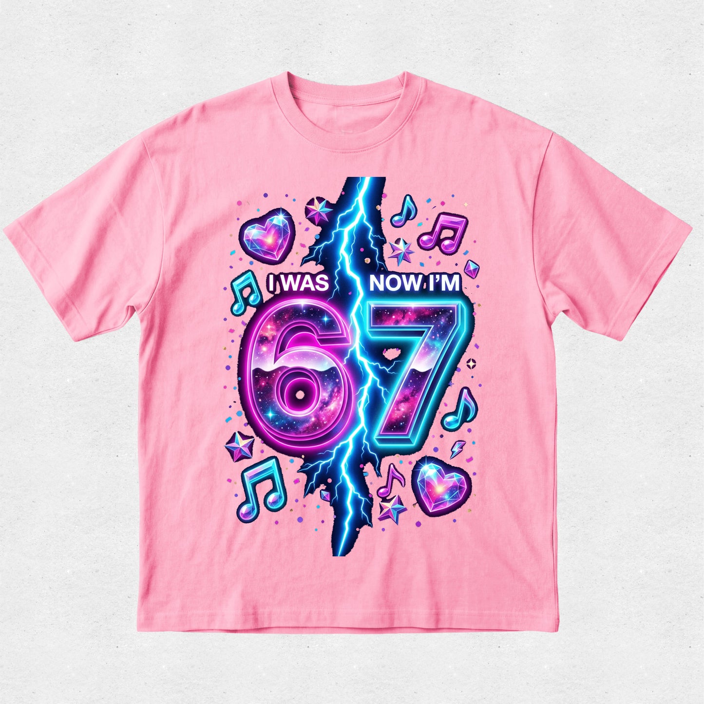 Pink t-shirt with a colorful design celebrating turning 67 on a light gray background