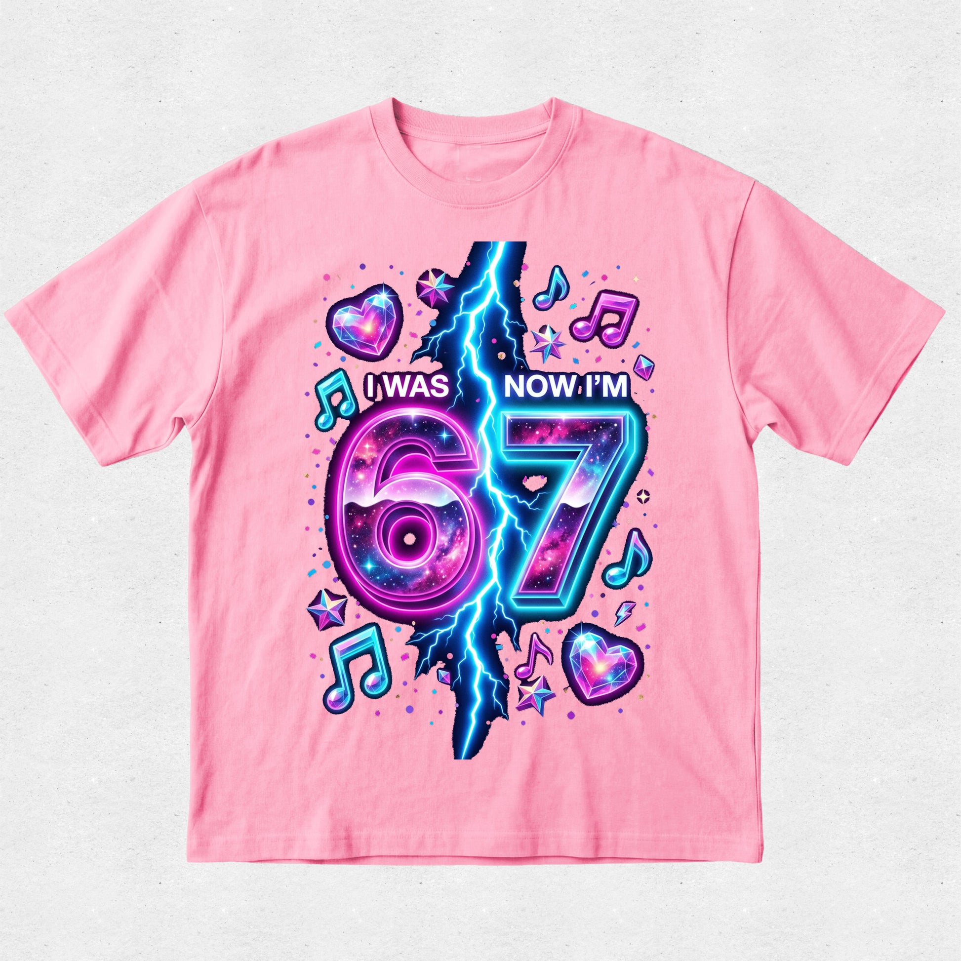 Pink t-shirt with a colorful design celebrating turning 67 on a light gray background