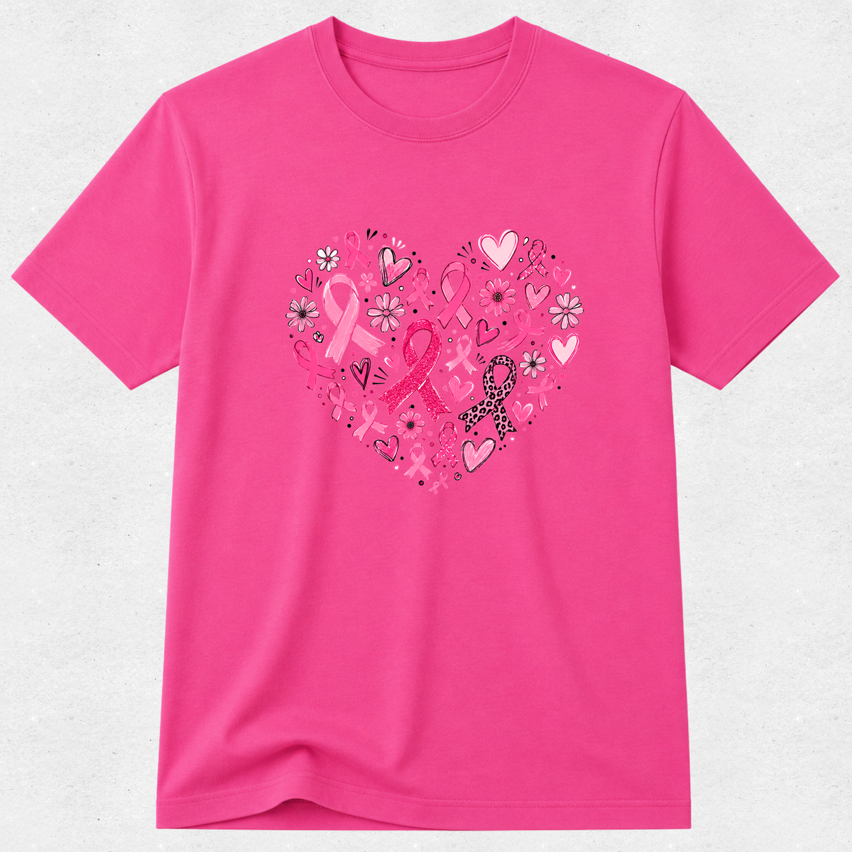pink breast cancer awareness T-shirt with a heart design made of pink ribbons, flowers and hearts.