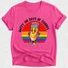Pink t-shirt with a colorful pencil graphic and 'Happy 100 Days of School' text on a white background