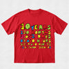 A red short-sleeve crewneck t-shirt featuring a colorful retro graphic on the front that lists time conversions: 10 Years, 120 Months, 3,652 Days, 87,660 Hours, 3,259,000 Minutes, and 51,532,000 Seconds.