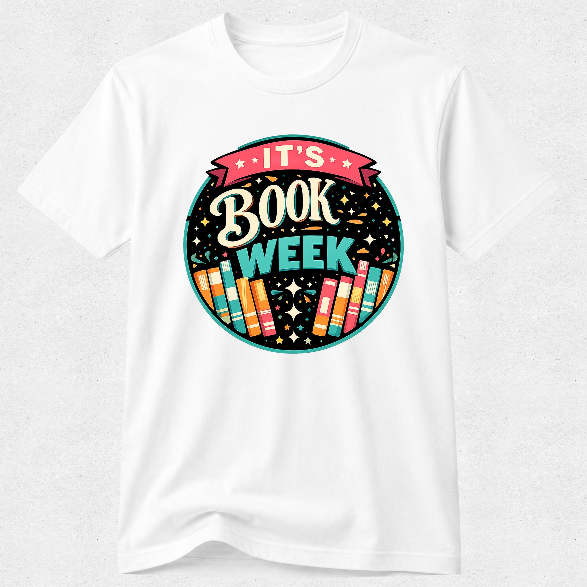 A white short-sleeve crewneck t-shirt featuring a colorful circular graphic on the chest that reads 'IT'S BOOK WEEK' with stylized books and stars.