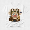 A white short-sleeve crewneck t-shirt featuring a detailed graphic print of a book-themed costume vest with props like a bow tie, map, and books, with the text 'THIS IS MY BOOK WEEK COSTUME!'.