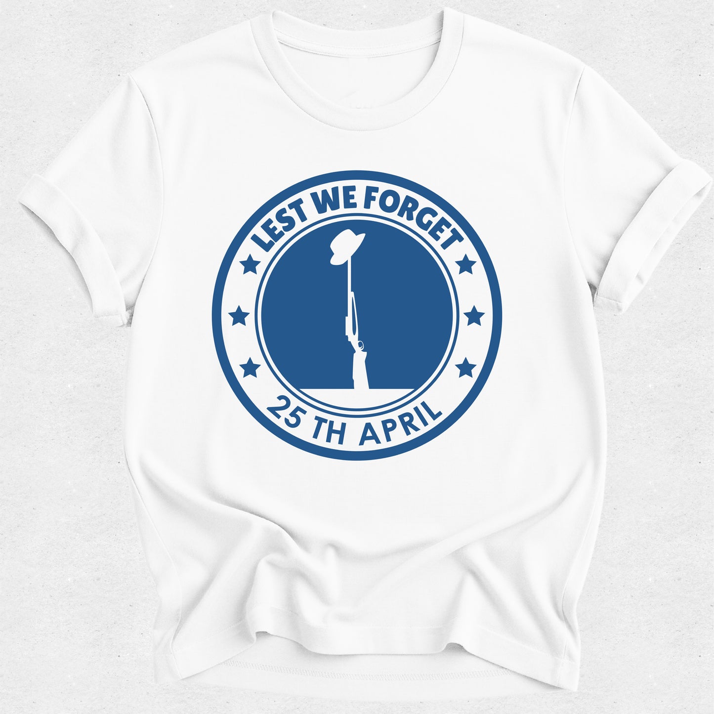 White t-shirt with blue 'Lest We Forget' design featuring a soldier and rifle on a white background