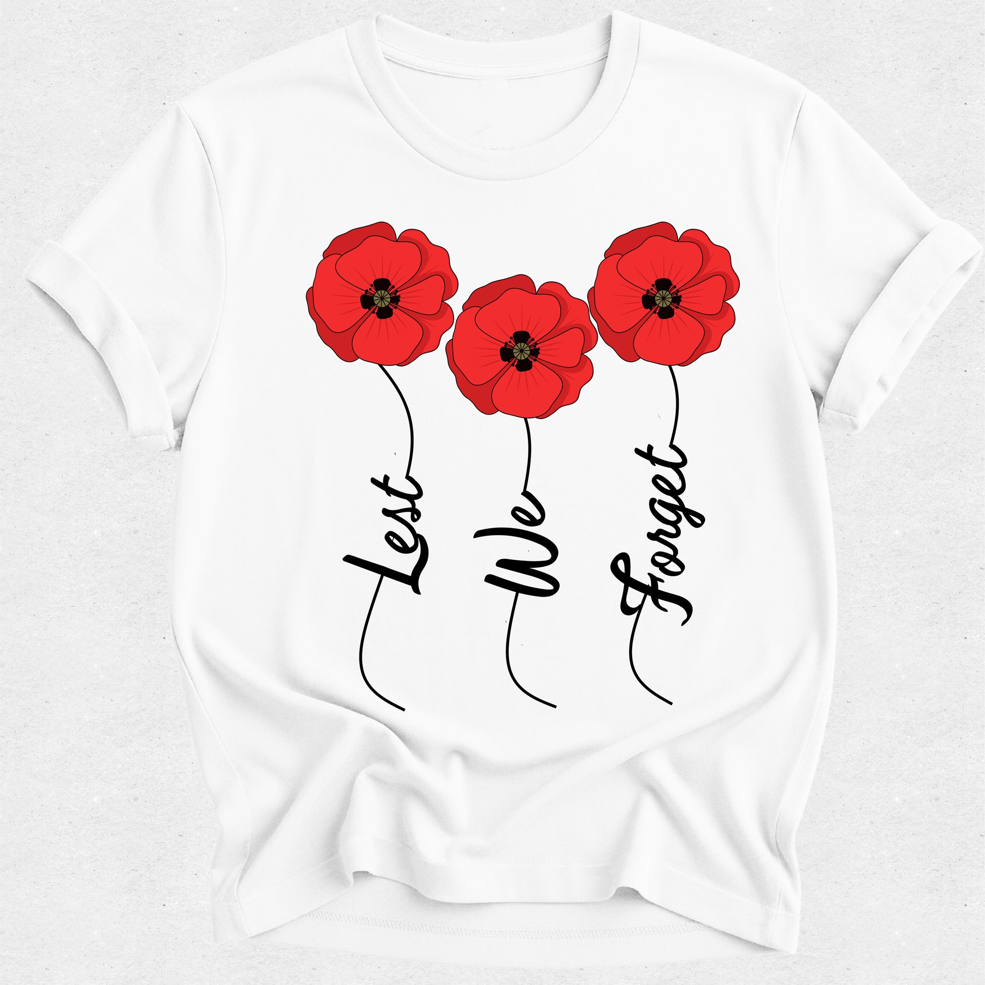 White t-shirt with red poppies and 'Lest We Forget' text on a white background