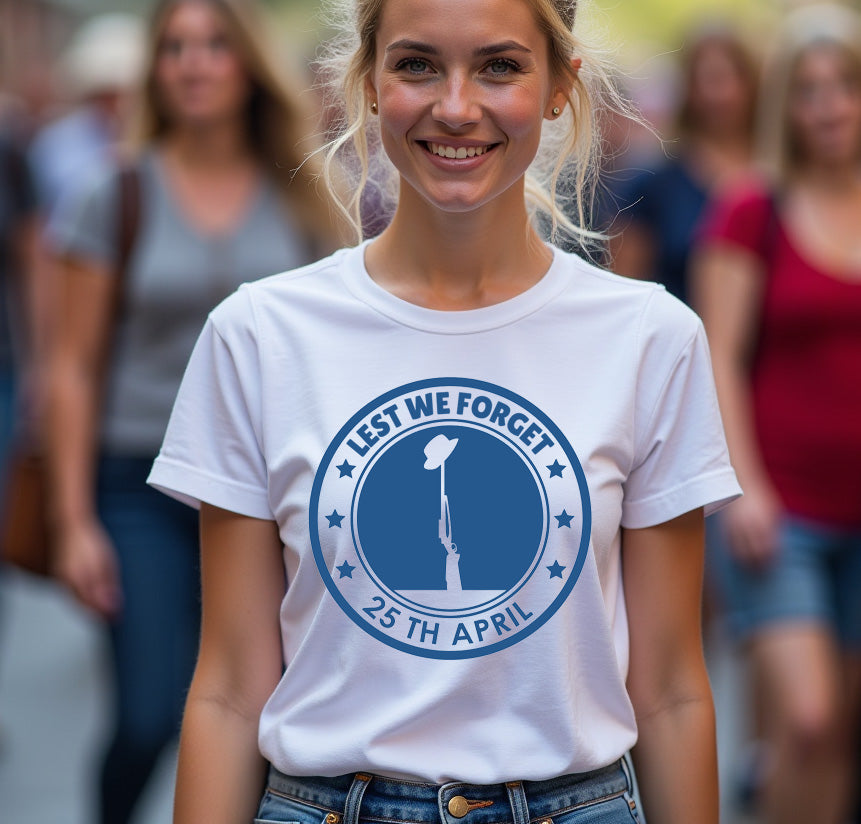 Woman wearing a white t-shirt with a blue 'Lest We Forget' design in a crowd.