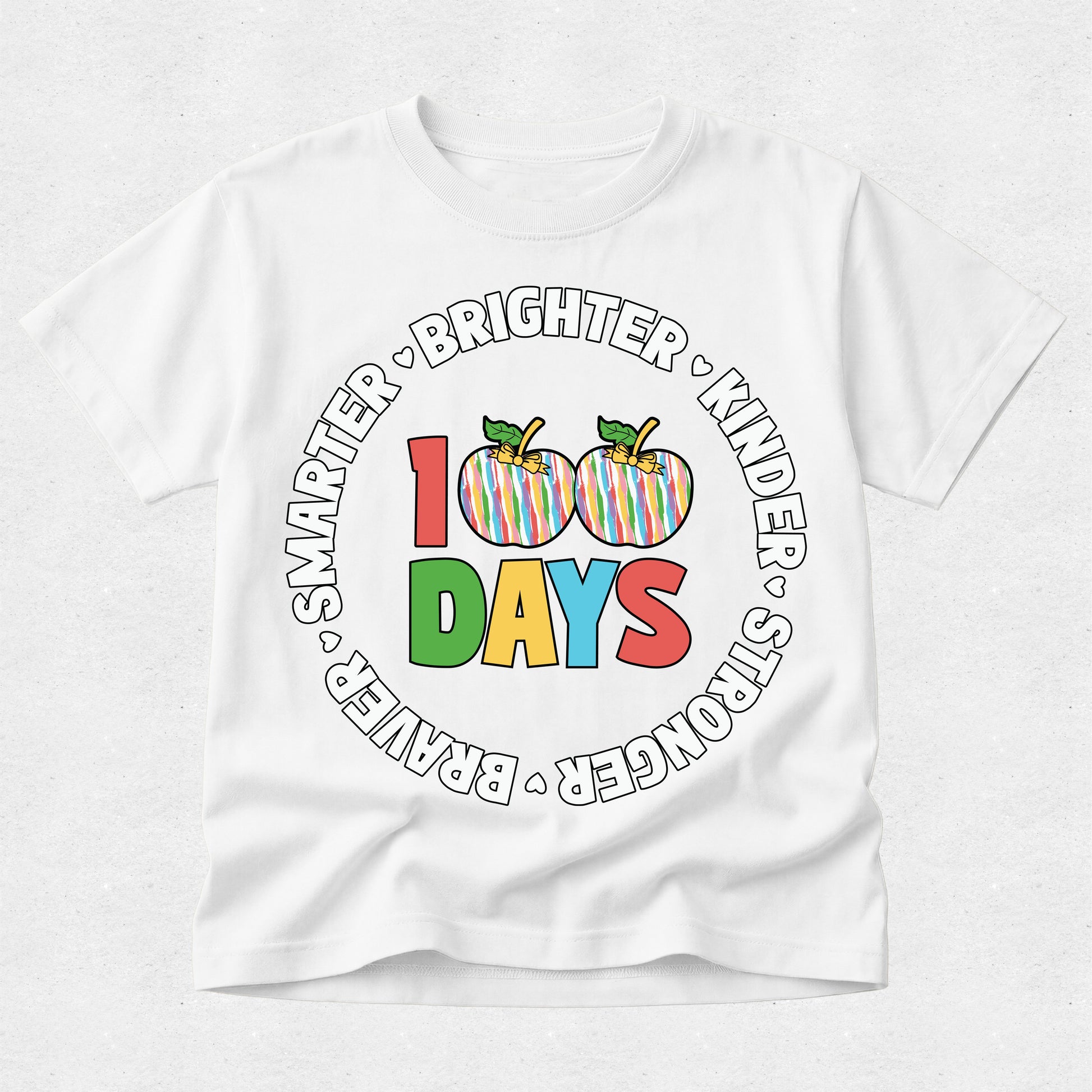 A white short-sleeve kids' t-shirt with a colorful graphic on the front that reads '100 DAYS' with two striped apples and the words 'SMARTER • BRIGHTER • KINDER • STRONGER • BRAVER' in a circular arrangement.