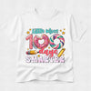 A white short-sleeve t-shirt with a colorful graphic on the front that reads 'Little Miss 109 days SMARTER' with a donut, swirl donut, pencil, and star details, shown on a light gray background.
