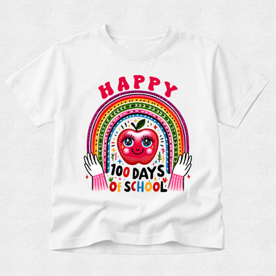 A white short-sleeve t-shirt with a colorful graphic on the front featuring a smiling red apple, a rainbow, and the text 'HAPPY 100 DAYS OF SCHOOL'.