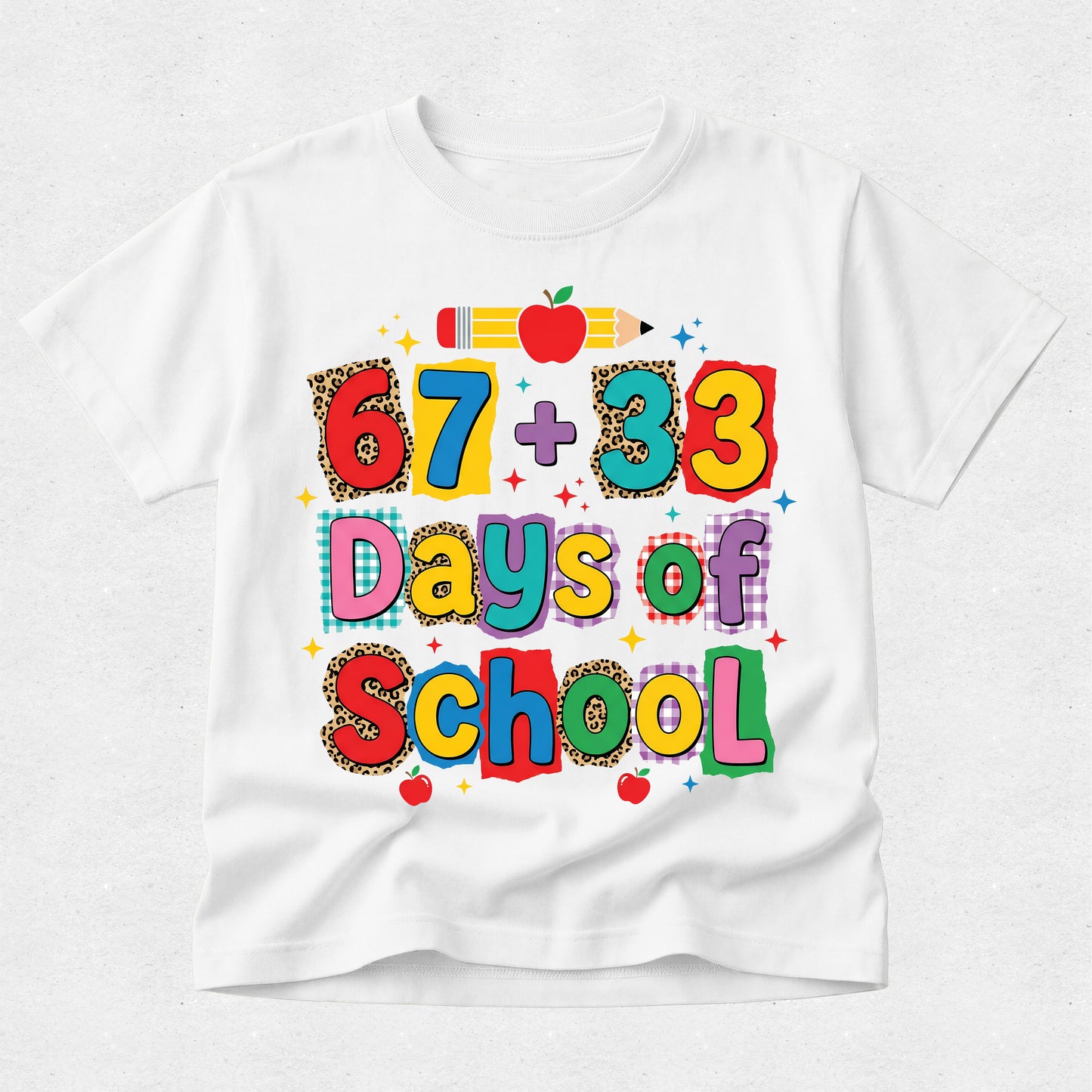 A white short-sleeve t-shirt with a colorful graphic that reads '67 + 33 Days of School' in playful multicolored letters, decorated with a pencil, apple, and leopard-print patterned letters, shown on a light gray background.