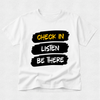 A white short-sleeve crewneck t-shirt with a graphic design on the front. The design features three horizontal black brushstroke blocks with the words 'CHECK IN', 'LISTEN', and 'BE THERE' in yellow, white, and black lettering respectively, set against a light gray textured background.
