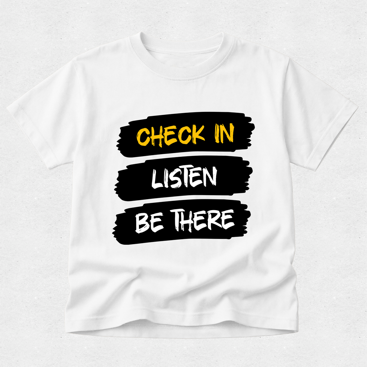 A white short-sleeve crewneck t-shirt with a graphic design on the front. The design features three horizontal black brushstroke blocks with the words 'CHECK IN', 'LISTEN', and 'BE THERE' in yellow, white, and black lettering respectively, set against a light gray textured background.