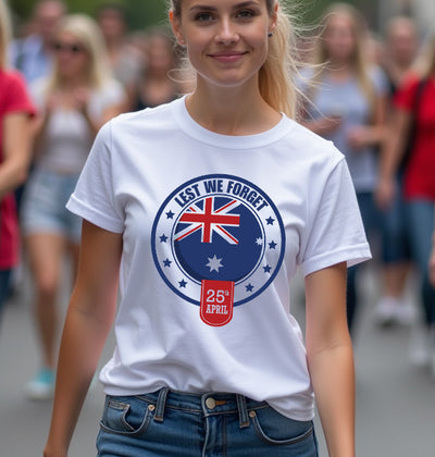 Woman wearing a white t-shirt with a ' lest we forget' design in a crowd.