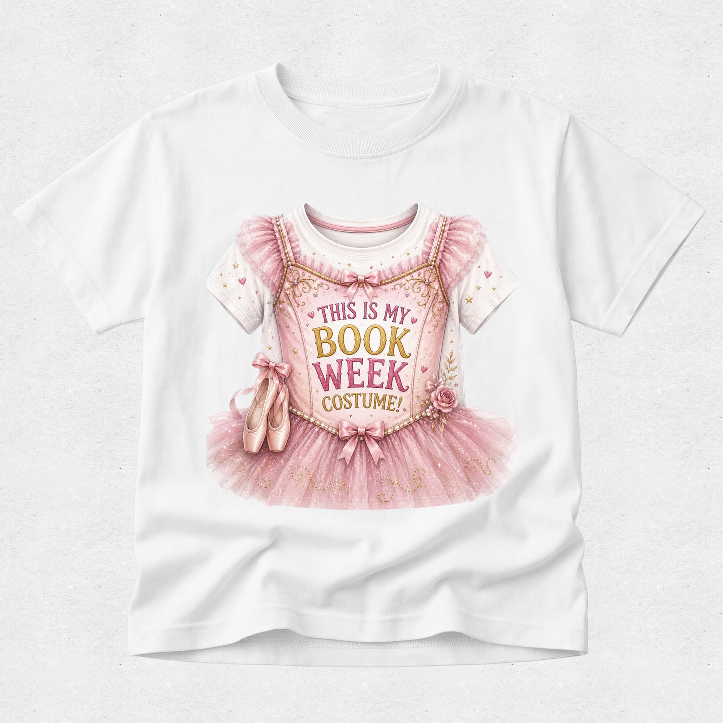 A white short-sleeve crewneck t-shirt featuring a graphic print of a pink ballerina costume dress with the text 'THIS IS MY BOOK WEEK COSTUME!' and ballet slippers, displayed on a light gray textured background.