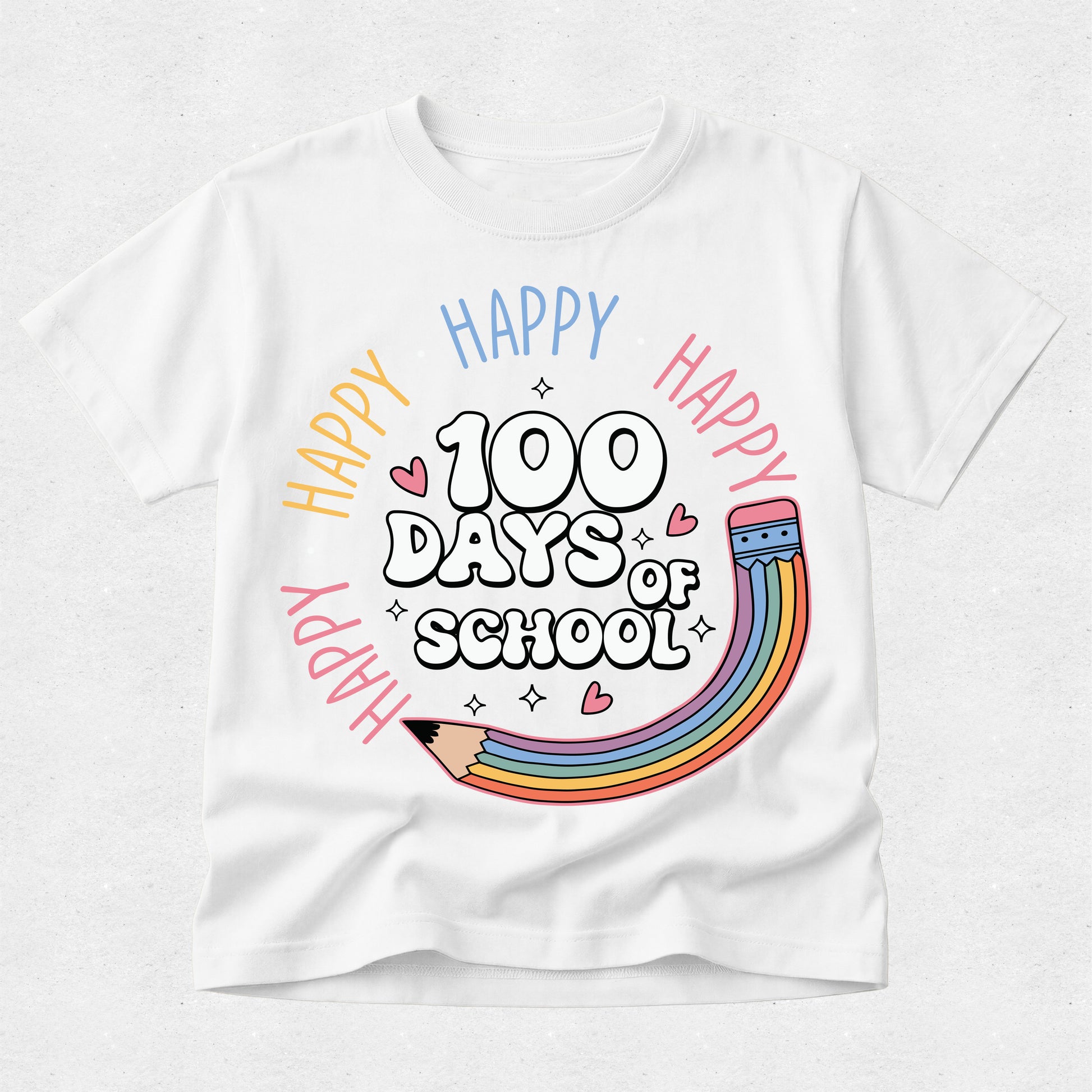 A white short-sleeve crewneck t-shirt featuring a colorful graphic design on the front. The design reads '100 DAYS OF SCHOOL' in a playful black-and-white font, surrounded by 'HAPPY' written in multiple colors (yellow, orange, pink, blue) in an arc, with a cute rainbow pencil illustration at the bottom.
