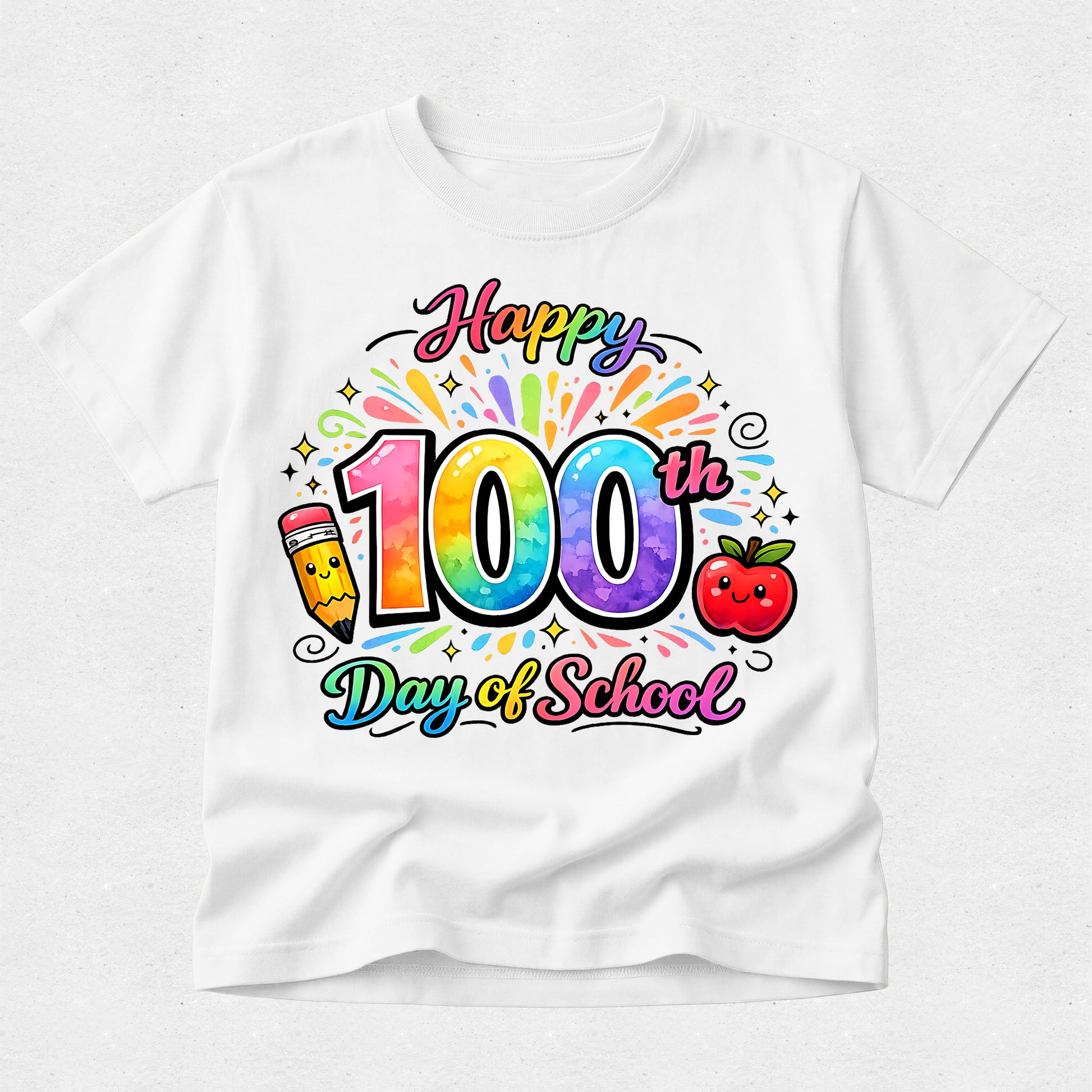 A white short-sleeve crewneck t-shirt featuring a colorful 'Happy 100th Day of School' graphic on the front, complete with a rainbow-striped pencil, a smiling red apple, and star accents.