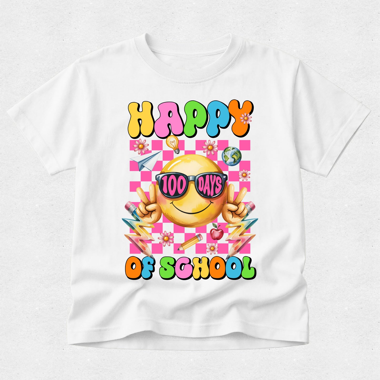 A white short-sleeve crewneck t-shirt featuring a colorful 'Happy 100 Days of School' graphic on the front. The graphic includes a yellow smiley face wearing pink sunglasses, colorful checkered background, and school-themed illustrations like pencils, flowers, and apples.