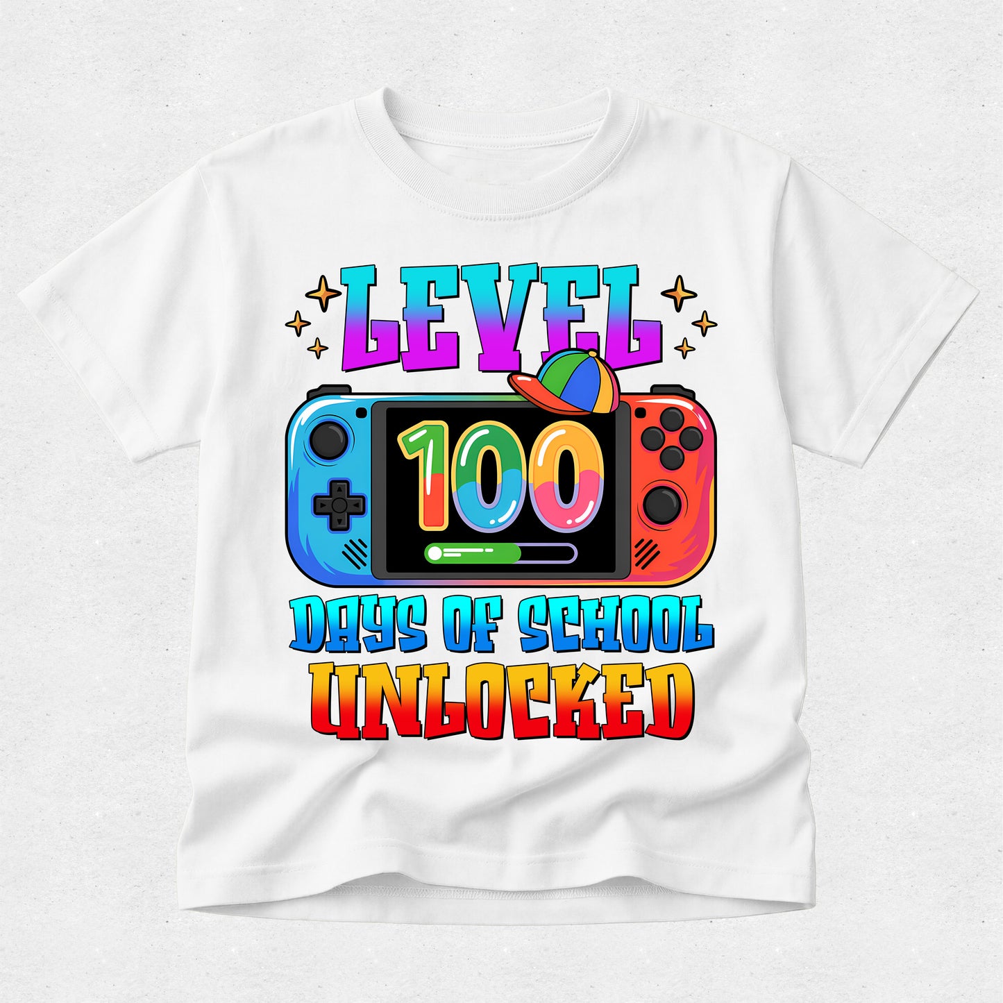 A white short-sleeve t-shirt with a colorful graphic print celebrating 'Level 100 Days of School Unlocked' featuring a Nintendo Switch design and rainbow-colored text.