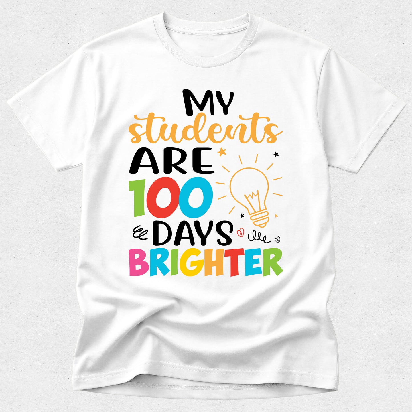 White t-shirt with colorful text 'My students are 100 days brighter' on a white background