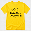 A bright yellow short-sleeve crewneck t-shirt with a black graphic print on the front showing a rising sun and the text 'Make Time to Check In' with a small smiley face underneath, displayed on a light gray textured background.