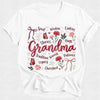 White t-shirt with 'Grandma' graphic design featuring text and floral elements on a white background