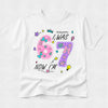 White t-shirt with colorful birthday design on a white background