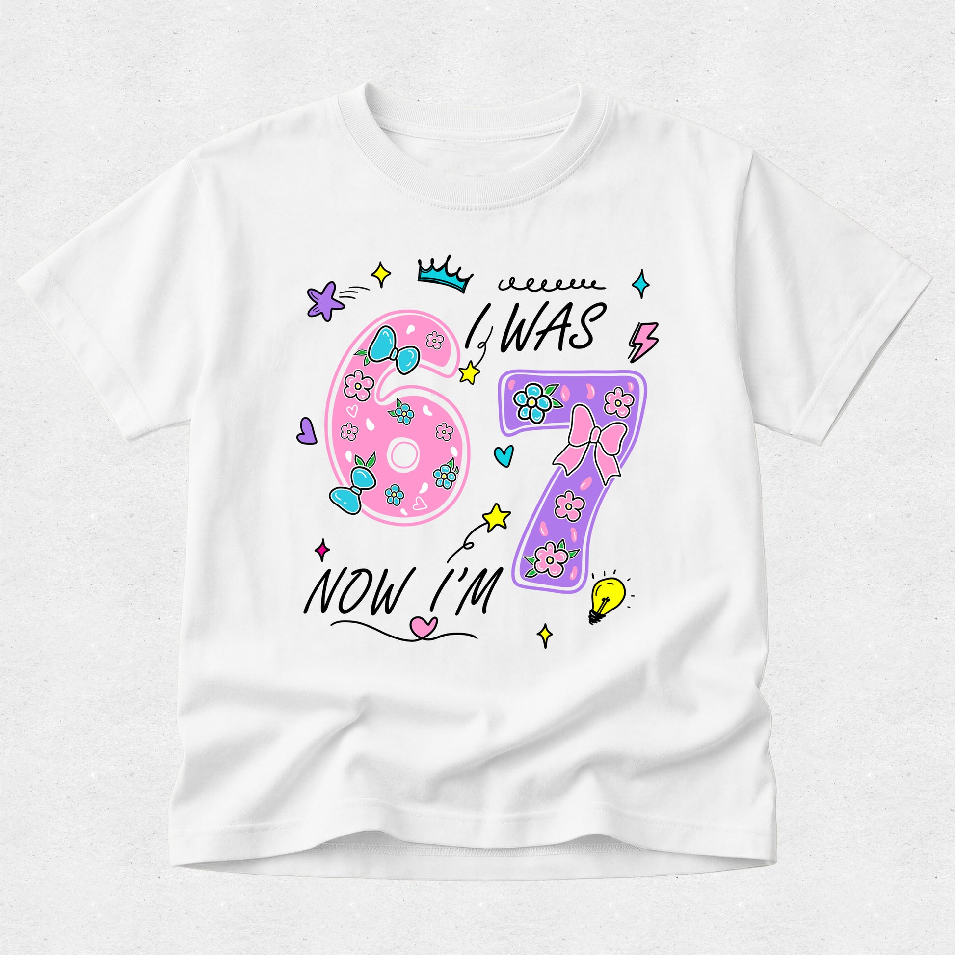 White t-shirt with colorful birthday design on a white background