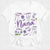 White t-shirt with purple text and floral nana designs on a white background