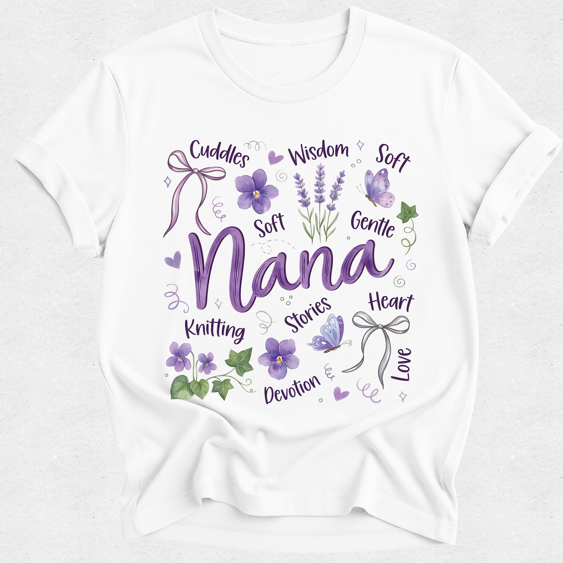 White t-shirt with purple text and floral nana designs on a white background
