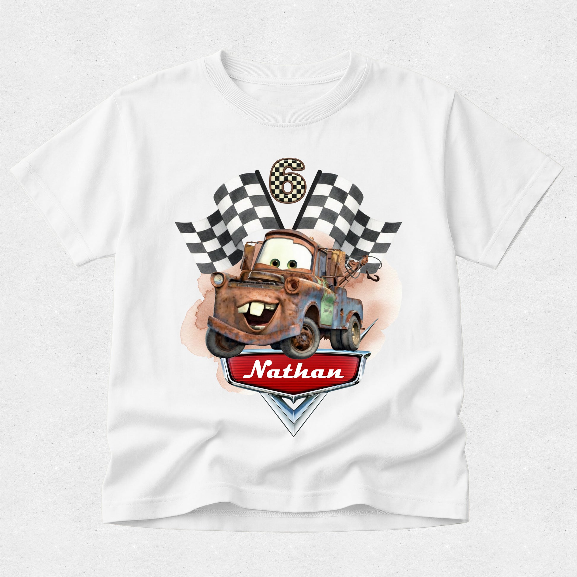 White t-shirt with a cartoon truck graphic and 'Nathan' text on a white background