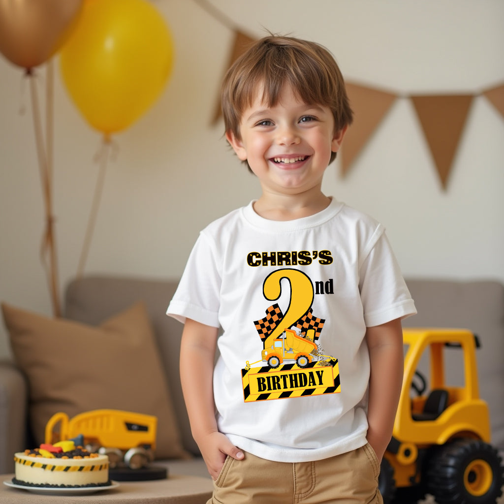 Toddler wearing a personalised construction 2nd birthday t-shirt featuring a yellow cement mixer truck and construction theme.