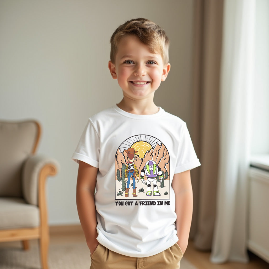 Child wearing a white t-shirt with a graphic design of characters from Toy Story, standing in a room.