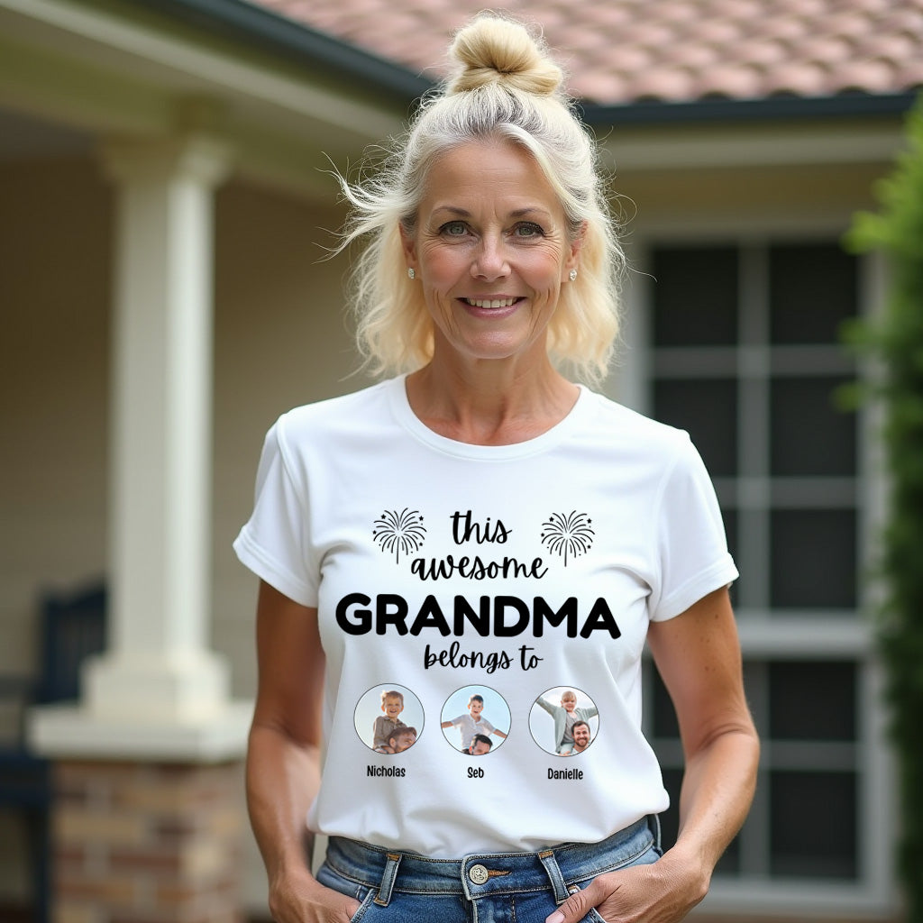 Woman wearing a white t-shirt with 'this awesome GRANDMA belongs to' text and three small images of children.