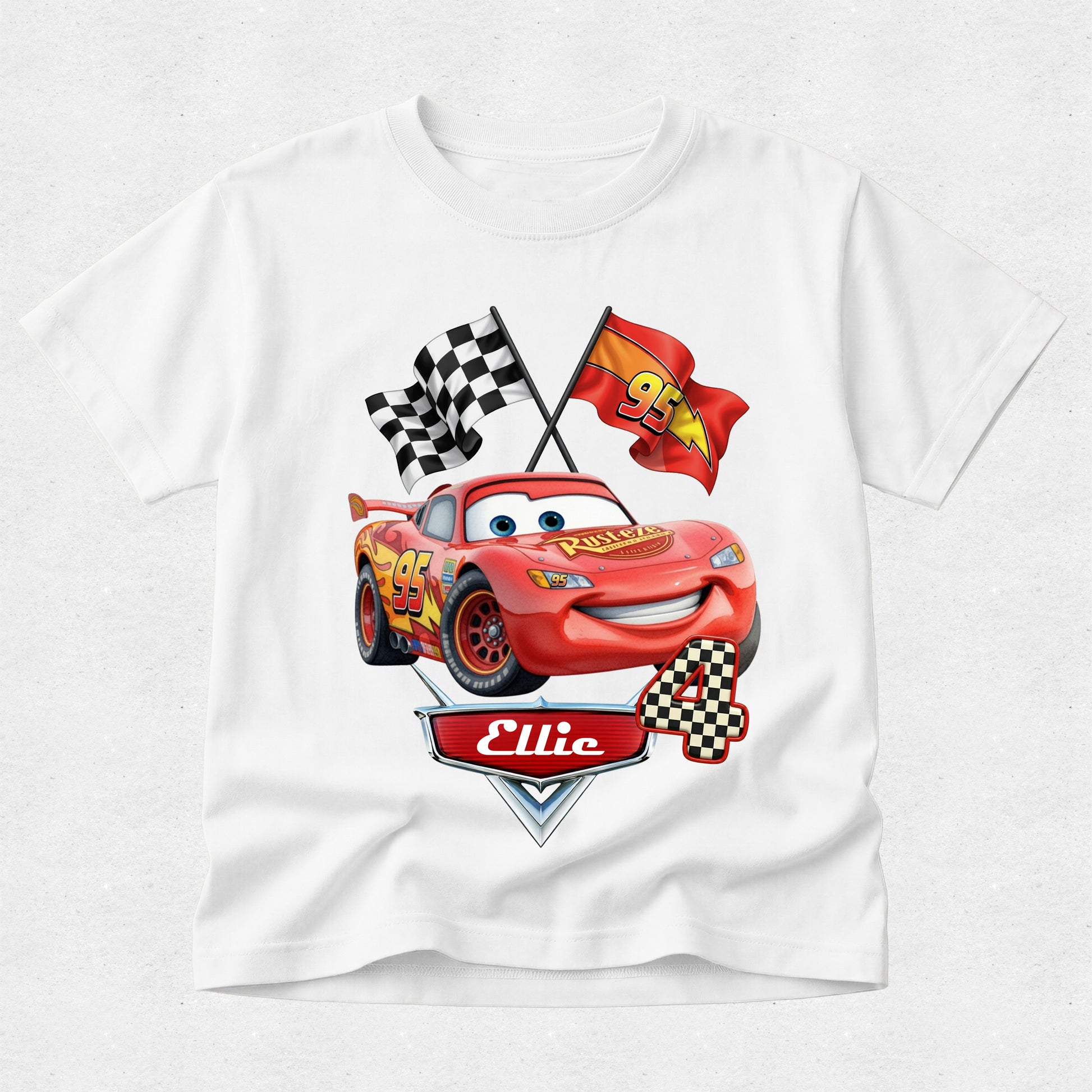 White t-shirt with a cartoon car design featuring flags and text on a white background