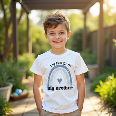 Child wearing a 'Promoted to Big Brother' shirt outdoors.