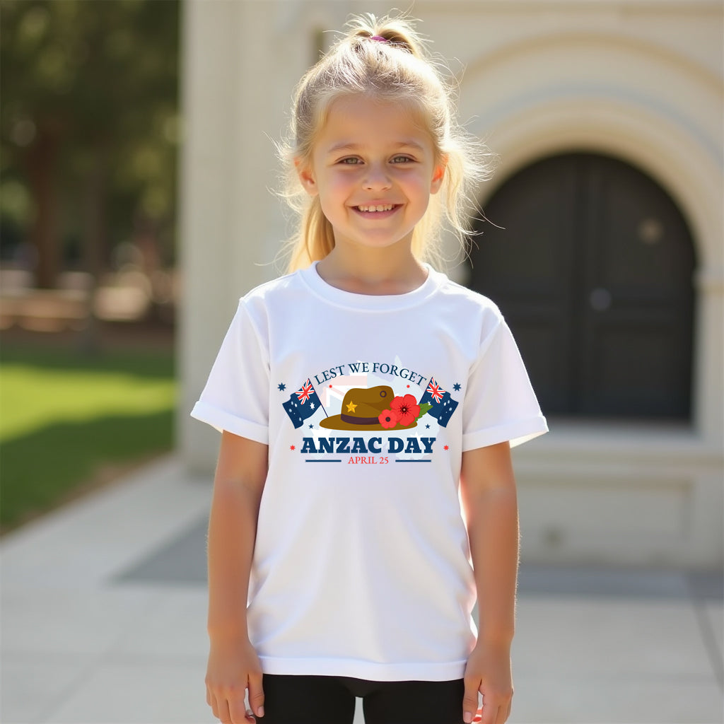 Young girl wearing a white t-shirt with ANZAC Day design outdoors.