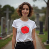 Woman wearing a white t-shirt with a red poppy design in anzac day memorial