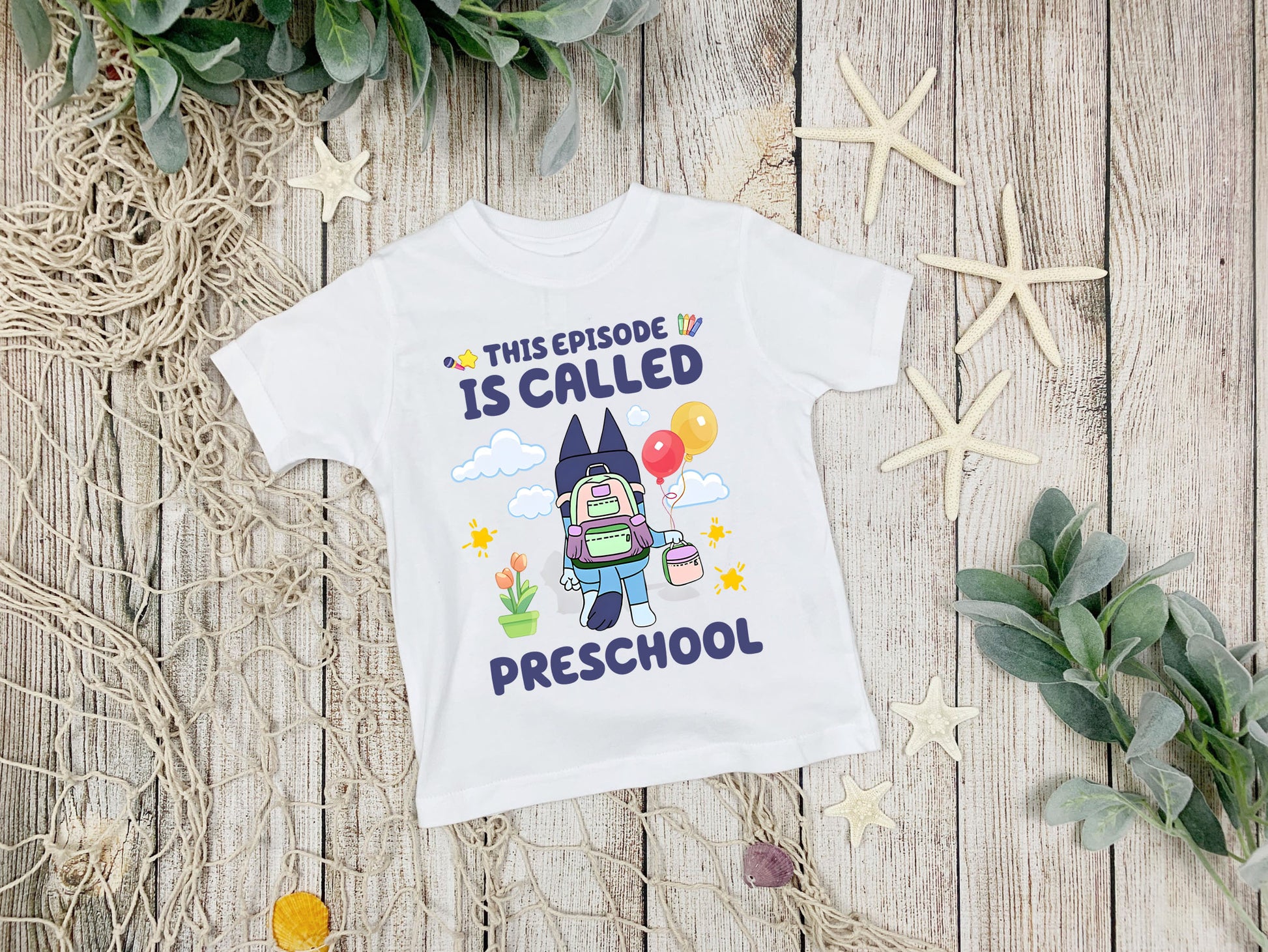 Flat lay of This Episode Is Called Preschool Bluey inspired t-shirt